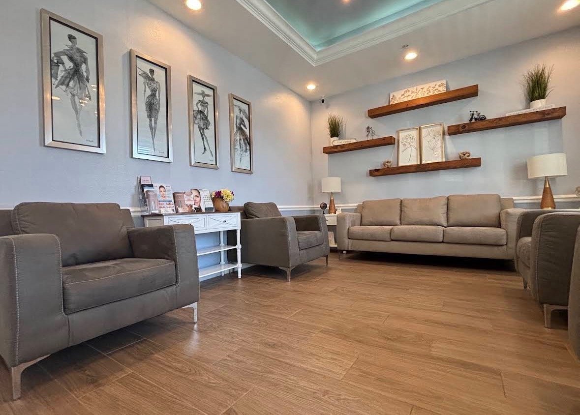 Liquid Love Med Spa lounge and waiting area with a teal accent ceiling